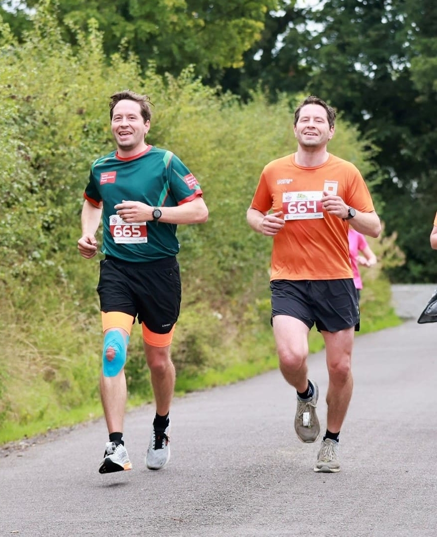 Two runners, twin brothers race on road